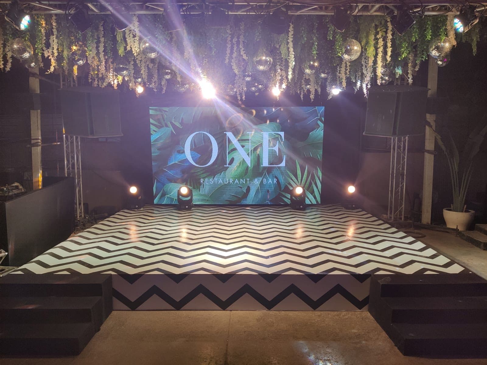 Product launch stage with dramatic lighting and LED backdrop